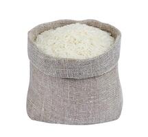 Jasmine rice in bag isolated on white background photo