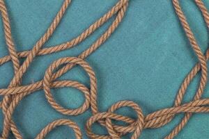 Ship rope on blue background, top view with copy space photo