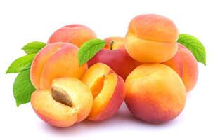 Group of apricots with leaves isolated photo