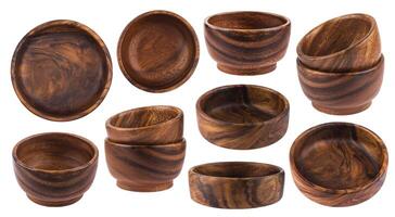 Empty wooden bowls isolated on white background photo