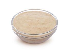 Sesame sauce. Tahini isolated on white background photo