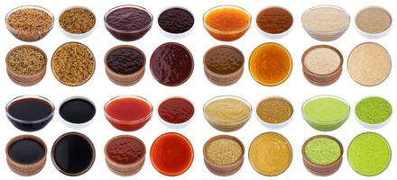 Different sauces isolated on white background photo