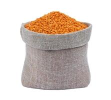 Red lentils in bag isolated on white background photo