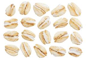 Oat flakes isolated on white background. Top view. Close up. photo