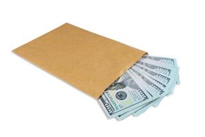 Pile of new design US dollar bills in brown envelope isolated on white background photo