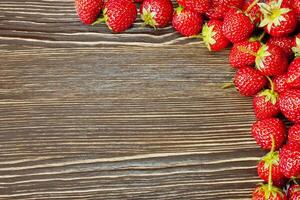 strawberry on a wooden background photo