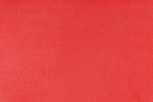 Texture of red fabric diagonal weave pattern. Decorative textile background photo