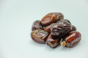 Dried dates on a white background photo