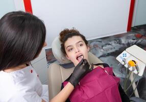 Woman having dental examination in stomatology clinic Treatment of caries, modern medicine. photo