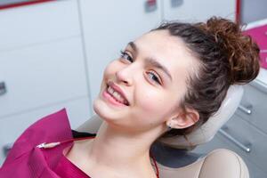 Woman having dental examination in stomatology clinic Treatment of caries, modern medicine. photo