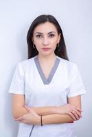 Dentist examining patient teeth in dental clinic. Dentistry and healthcare. Dentist holding dental tools in her hands. photo