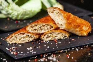 Traditional fried pies from Romania with potatoes, cheese and cabbage. Romanian food. photo