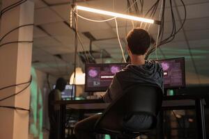 Cyber attack, hacker using spyware, breaking into database server. Criminal stealing privacy information, data phishing, woman coding malicious software at night time, cybercrime photo