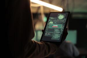 Access denied message on digital tablet screen, unsuccessful password cracking, database hacking fail. Cyberattack, internet thief stealing electronic information, using malicious software photo