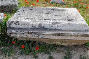 Fragments of ancient buildings, ruins of the ancient city of Hierapolis. Stone blocks with traces of stone machining. photo