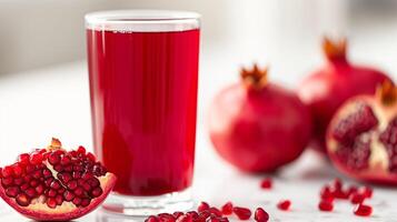 AI generated Glass of Pomegranate juice with Pomegranate fruit isolated on white background. photo