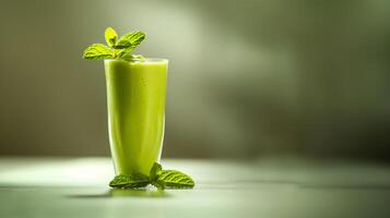 AI generated glass of fresh avocado smoothie isolated on blurred green background photo