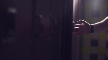 Close-up of modern security system on lockers in gym. Frame. View of person applying bracelet on hand opening drawer video