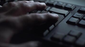 Pressing key with your finger. Closeup of male finger presses button on black computer keyboard. Man nervously presses enter button to send documents for work video