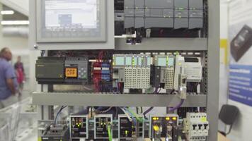 Control panel in the factory. Switch Control , Many electronic devices. Electric stand with devices and screen video