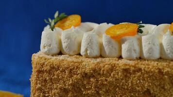 Biscuit layered cake with cream curd decorated with kumquat. Layered cake with cream video