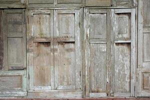 Rustic aged wooden window on building village photo