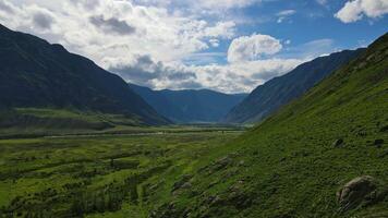 Mountainous landscape with fields and clouds video