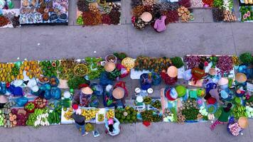 Aerial view of busy local daily life of the morning local market in Vi Thanh or Chom Hom market, Vietnam. People can seen exploring around the market. video