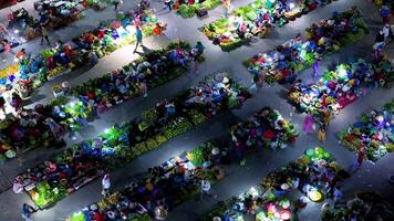 Aerial view of busy local daily life of the morning local market in Vi Thanh or Chom Hom market, Vietnam. People can seen exploring around the market. video