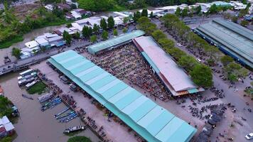 Aerial view of busy local daily life of the morning local market in Vi Thanh or Chom Hom market, Vietnam. People can seen exploring around the market. video