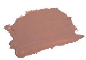 close-up smear of foundation, red clay masks on a white background photo