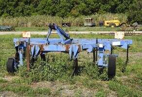 Plow on trailer for tractor. Plow for plowing soil. photo