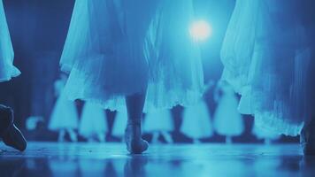 Legs of a Ballerina. Ballerina's feet in pointe shoes move slowly in dance on stage. video