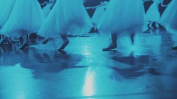 Ballerinas run in a circle on the stage. Close-up of the legs. video