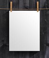 White blank poster template on a wooden background. Mock up for your project with copy space photo