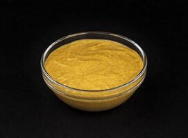 Mustard isolated on black background photo