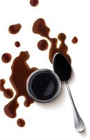 Soy sauce. Splash of soy sauce isolated on white background with clipping path. Top view photo