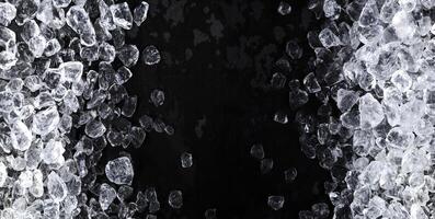 Pieces of crushed ice on black background photo