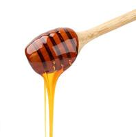 Honey stick isolated on white photo