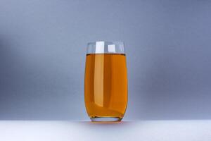 Glass of apple and grape juice isolated on white background photo
