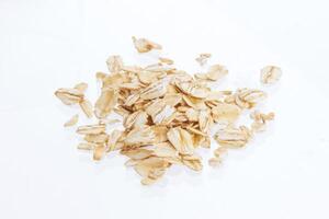 Oat flakes isolated on white background. Close up. photo