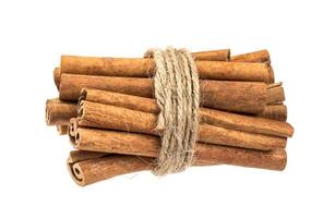 Cinnamon sticks bunch isolated on white background with clipping path photo