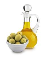 Olive oil and green olives isolated on white background photo