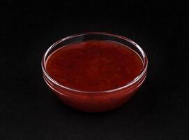 Cranberry sauce isolated on black background photo