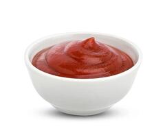 Ketchup in bowl isolated on white background. Portion of tomato sauce. With clipping path. One of the collection of various sauces photo