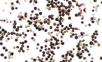 Different peppers isolated on white background black, red, green and white peppercorns photo
