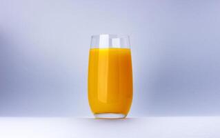 Glass of orange juice isolated on white background with copy space photo