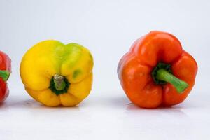 Three bell peppers isolated on white background. Bell peppers of various colors on a white background. photo