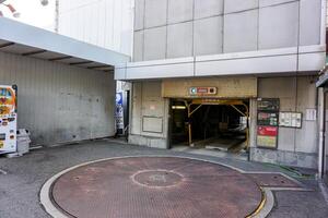 Osaka City, Japan, 2023 - Elevator Parking lot's building. This type of parking is a lift up to the building, when we drive into the car park then the car will go up to collect by automatic. photo