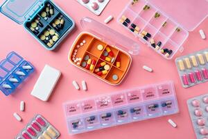 Flat lay composition with pill boxes and blisters on color background photo